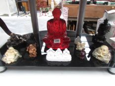 11 assorted Buddha figures.