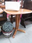 An Ercol table top with base.