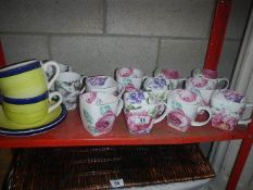 A shelf of china mugs etc.