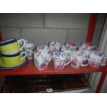 A shelf of china mugs etc.