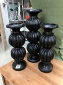 3 black candle holders.