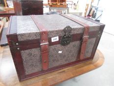 A leather bound trunk.