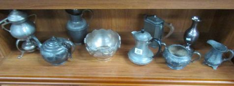 A mixed lot of metal teapots, jugs etc including pewter and silver plate.