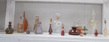 A shelf of assorted perfume bottles.