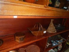 A pair of oak barley twist candlesticks and other wooden items.