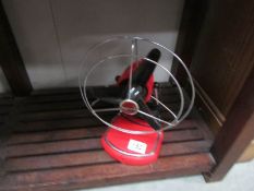 A red retro style desk fan.