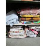 2 shelves of blankets, table cloths, duvet covers, pillow cases etc.