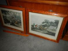 2 framed and glazed French hunting prints in maple walnut veneer frames.