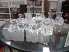 10 assorted glass scent bottles.