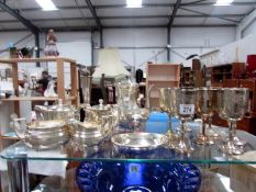 A mixed lot of metal ware including tea sets, goblets, posy vase etc.