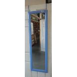 A blue rectangular over the door mirror.