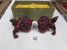 A boxed pair of Dogs of Foo ornaments.
