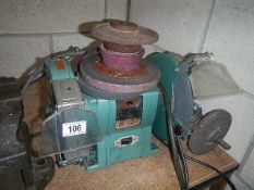 An electric bench grinder and discs.