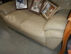 A 2 seat fawn leather sofa.