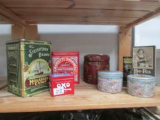 A shelf of old tins and boxes.