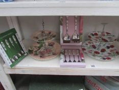2 cake stands and 3 boxed cutlery sets.