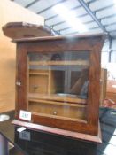 An oak smoker's cabinet.