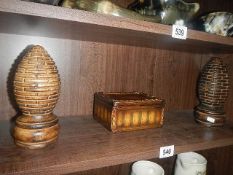 2 ethnic carved cones and a lidded box.