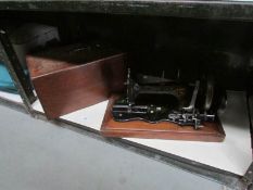 A Frister and Rossman vintage sewing machine in inlaid case.