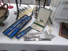 A mixed lot of cutlery including cased sets.