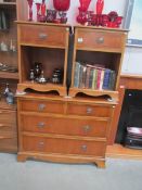 A 2 over 2 chest of drawers and a pair of matching bedsides.