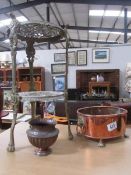 A brass 2 tier plant stand, a copper planter and a small pot.