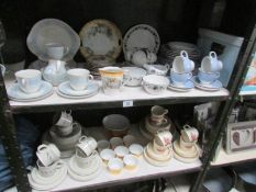 2 shelves of assorted dinner ware including Royal Doulton.