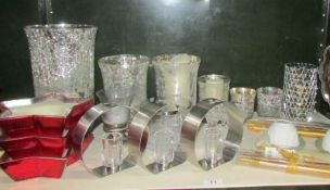 A mixed lot of candle holders and candles including Wedgwood.