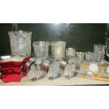 A mixed lot of candle holders and candles including Wedgwood.