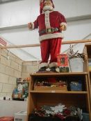 A large quantity of Christmas decorations including animatronic Santa, 3 Christmas trees,