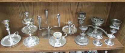 A mixed lot of candlesticks and candelabra.