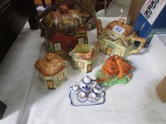 A cottage ware teaset and biscuit barrel etc (chips to teapot).