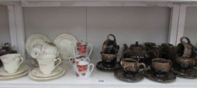 A Cornish pottery tea set, A Royal Doulton 18 piece tea set and an oriental teapot,