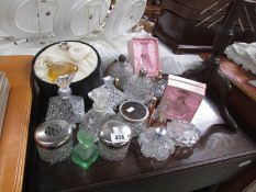 A mixed lot of scent bottles and trinket pots etc.