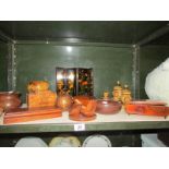 A shelf of assorted wooden items including smoking related.