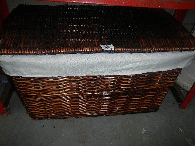 A wicker linen basket.