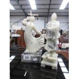 2 carved soapstone figures.