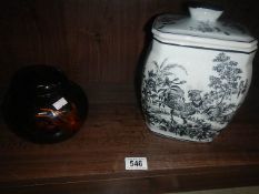 A ginger jar and a lidded jar with cockerel design.