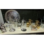 A shelf of silver plate, brass and pewter items etc.