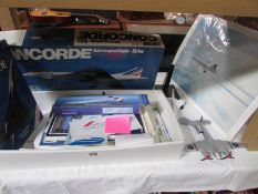 A Concorde model kit and other Concorde items (base to plane a/f).