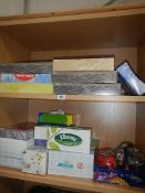 2 shelves of boxes of tissues.