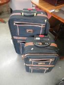 2 'The Graduated Constellation International' suitcases on wheels.