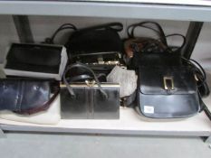 A shelf of various hand bags.