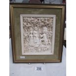 A framed medieval scene romantic plaque.