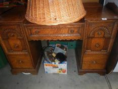 A carved oak dressing table.