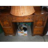 A carved oak dressing table.