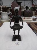 A painted metal Blackamoor figure.