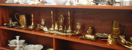 A mixed lot of brass ware, bells, tray, candlesticks. etc.