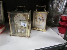 An Actim quartz clock and one other.