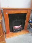 A fire surround with inset fire,